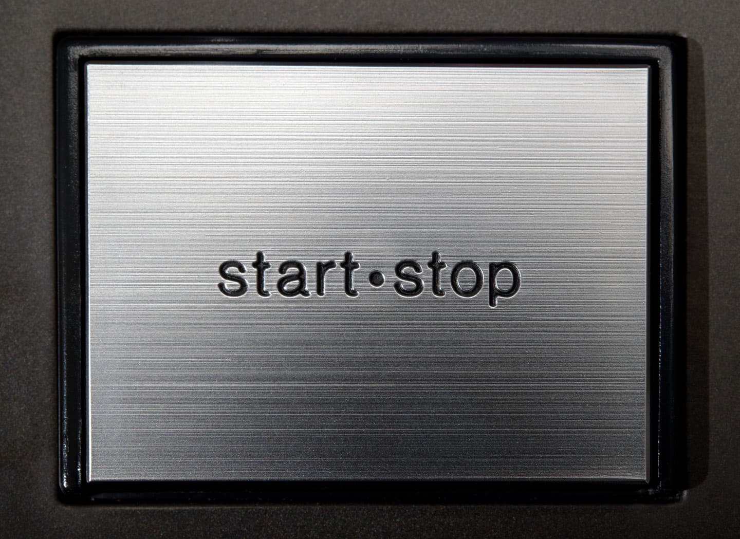 The start/stop button on a Technics SL-1210MK2.