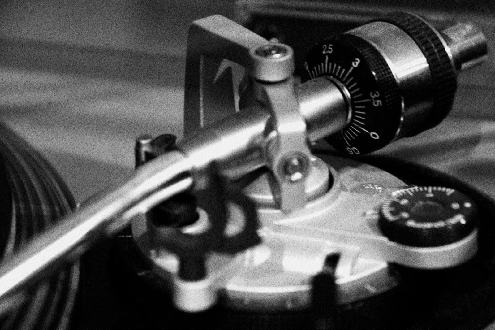 Tonearm pivot, counterweight and anti-skating dial on a silver Technics SL-1200MK2.